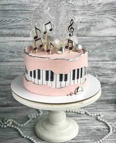 a pink cake with musical notes on it