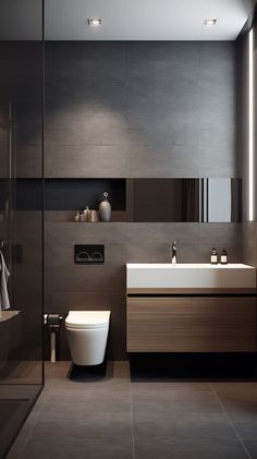 a bathroom with a toilet, sink and mirror in it's center wall next to a walk - in shower