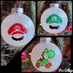 three christmas ornaments with mario and luigi's hats on them, hanging from a tree