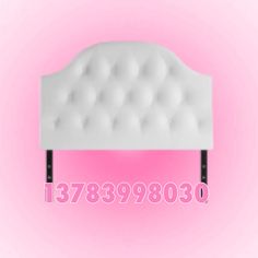 a white headboard with pink background and numbers below it that read, 7578990380