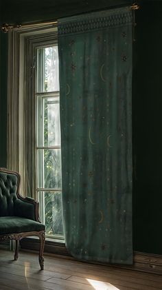 a chair sitting in front of a window next to a green curtain with the moon and stars on it