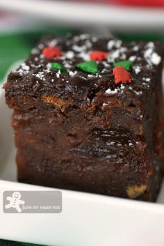 two pieces of brownie sitting on top of a white plate next to each other