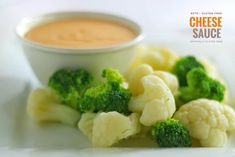 broccoli florets and cauliflower on a plate with dipping sauce