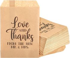 some brown paper bags with the words love and thanks from the new mr and mrs