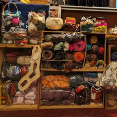 a display case filled with lots of different types of crochet and knitting supplies