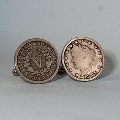 New, hand crafted cufflinks, made from genuine coins.With the last coin for circulation minted in 1912, more than 100 years ago, Liberty nickels certainly qualify as antiques. These cufflinks are made with Liberty nickels.Coin Year(s):                    1883-1913Coin Size (Diameter):     21 mmCoinColor:                       Silver ToneCufflink backs:                Silver ToneYou can select both Cufflinks to me made with the "V" side, the "Liberty Head" side, or one of each.The condition of th Vintage Engraved Collectible Cufflinks, Vintage Engraved Cufflinks For Anniversary, Vintage Collectible Cufflinks, Antique Round Cufflinks For Anniversary, Vintage Round Cufflinks For Gift, Vintage Round Cufflinks As Gift, Classic Stamped Coin Jewelry, Silver Coin Ring, 5 Cents