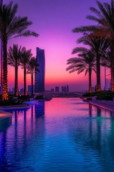 A pool bar at a luxury hotel with bar stools in the water, offering drinks and refreshments to guests by the pool. Pool Bars