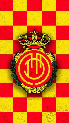 a red and yellow checkered wall with a crown