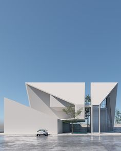 a car is parked in front of a white building with triangular shaped windows and doors