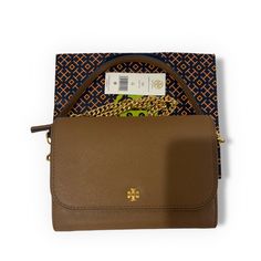 Nwt Tory Burch Emerson Chain Wallet Crossbody Brand: Tory Burch Collection: Emerson Description: Chain Wallet Style Number: 136093/0522 Color: Moose/909 Detail & Fits Leather: Saffiano Leather Hardware: Gold Tone Polished Finish Compatible: To Fit An Iphone 13 Pro Max Closure: Flap With Magnetic Snap Closure Strap: Removable Crossbody Chain And Leather Strap With Approx 23" Drop, Not Adjustable Exterior: Gold Hardware1 Slip Pocket On Back Interior: 1 Front Zipper Compartment, 6 Credit Card Slots Tory Burch Cell Phone Bag, Tory Burch Emerson, Leather Hardware, Chain Wallet, Tory Burch Bag, Wallet Fashion, Wallet Chain, Iphone 13 Pro, Front Zipper