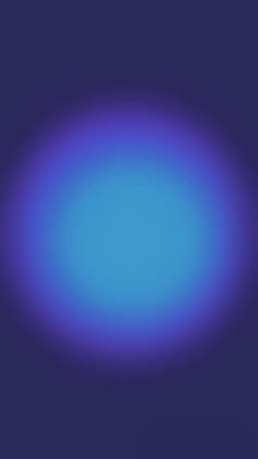 a blurry image of a blue circle on a purple background with space for text