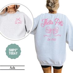 the back of a woman's sweatshirt that says sheeta pie and has a bow on it