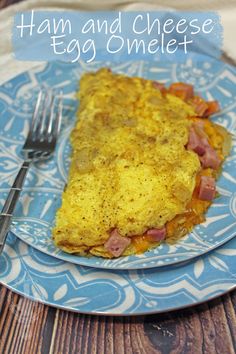 ham and cheese egg omelet on a blue plate with a fork next to it