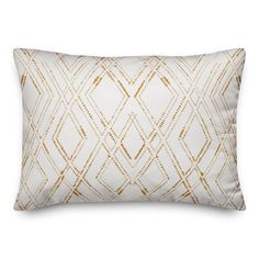 a white and gold pillow on a white background