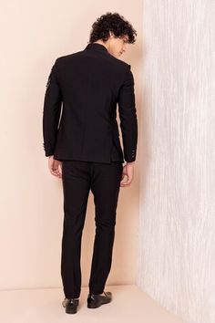 Black full sleeves jodhpuri bandhgala with all over tonal sequin Dragon embroidery on one shoulder. Paired with a pant. - Aza Fashions Fitted Unstitched Suit For Workwear With Long Sleeves, Festive Bandhgala For Workwear, Fitted Bandhgala For Festive Workwear, Fitted Nehru Jacket For Eid, Fitted Bandhgala For Work And Festive Occasions, Festive Fitted Bandhgala For Work, Fitted Nehru Jacket For Workwear And Eid, Luxury Black Bandhgala For Evening, Traditional Fitted Suits For Workwear