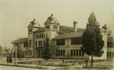 an old black and white photo of a large building