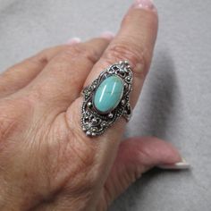 Breathtaking Solid 925 Sterling Silver Turquoise And Marcasite Ring. Lovely Filigree Design. This Beauty Measures 1 3/8" Long And Is Available In Various Ring Sizes. Well Made. Stamped 925. ***As To Be Expected, Turquoise Stones Will Vary Slightly, All Beautiful. Ref: W-A34 Bohemian Hallmarked Turquoise Ring, Silver Bohemian Turquoise Ring Hallmarked, Bohemian Silver Turquoise Ring Hallmarked, Blue Hallmarked Turquoise Ring, Turquoise Ring With Stone Setting In Silver, Silver Turquoise Ring With Natural Stones For Anniversary, Turquoise Ring Stamped 925 For Wedding, Rose Gold Crown Ring, Carved Wedding Ring