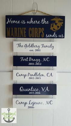 this sign is hanging on the wall and says, home is where the marine corp sends us