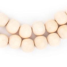 a group of white balls sitting on top of each other in front of a white background