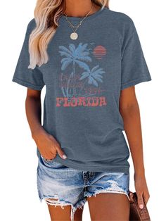 PRICES MAY VARY. Get ready for an adventure with our beach-inspired retro t-shirt featuring coconut trees at sunset. Made with a breathable and lightweight blend of cotton and polyester, this shirt is soft and comfortable to wear throughout the seasons. Our women's retro Los Angeles California t-shirt is a must-have for your wardrobe. With a minimalist cut, ribbed collar, and curved drop hem, this casual short-sleeve tee features a beach palm tree graphic that will transport you to paradise. Thi Summer Graphic Tee For Outdoor, Graphic Tee Tops For Summer Outdoor, Summer Graphic Print Tops For Outdoor, Graphic Tee Tops For Outdoor Summer Activities, Summer Outdoor Tops With Letter Print, Summer Outdoor Top With Letter Print, Summer Tops With Letter Print For Outdoor, Short Sleeve Printed Tops For Outdoor, Printed Short Sleeve Tops For Outdoor