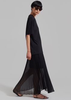 Color: Black  Lightweight fluid sheer fabric Relaxed silhouette Maxi length Pleating throughout Concealed side seam zip closure Partially lined  100% Polyester Dry Clean  By The Frankie Shop. Imported Summer Goth, The Frankie Shop, Frankie Shop, Sheer Skirt, Pleated Maxi Skirt, Simple Tees, Pleated Maxi, Sheer Fabric, Everyday Wardrobe