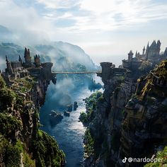 an aerial view of a castle on the edge of a cliff with a river running through it