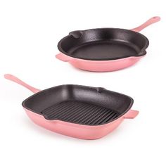 two black and pink frying pans sitting side by side on a white background