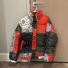 Brand New Condition Red Patchwork Outerwear For Streetwear, Casual Red Patchwork Outerwear, Streetwear Puffer Jacket With Patchwork, Streetwear Long Sleeve Puffer Jacket With Patchwork, Streetwear Patchwork Long Sleeve Puffer Jacket, Multicolor Fall Puffer Jacket For Outdoors, Red Patchwork Outerwear For Winter, Casual Quilted Red Outerwear, Casual Patchwork Puffer Jacket