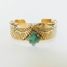 "A stylish bohemian stone cuff bracelet with phoenix wings in oxidized gold. It is for a woman who likes to wear bold jewelry with a boho vibe. - Material: brass plated with 24k gold (nickel free) and oxidized to give a matte, rugged look - Available in solid sterling silver, which is not oxidized unless requested - Stones: Choose from the drop down options - Size: 6 inches long (15 cm), 0.6 inches wide (1.7 cm), adjustable - Arrives in a lovely gift wrap, ready to give as a gift - Ships within Phoenix Bracelet, Phoenix Wings, Phoenix Jewelry, Boho Cuff Bracelet, Boho Cuff, Gold Cuff Bracelet, Brass Cuff Bracelet, Photography Course, Bold Jewelry