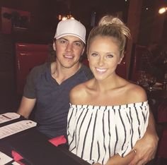 a man sitting next to a woman at a table