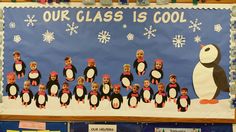 a classroom bulletin board with penguins and snowflakes on the front, surrounded by children's faces