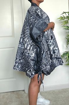 Dear to wear something different, with this beautiful stylish oversized African Tie Dye kimono jacket. Made with soft and comfortable %100 cotton fabric, this knee-length jacket features a stylish black and white color with African pattern design, large  front pockets, this is perfect for any occasion, whether it's party, casual, workwear, or business. The 3/4 kaftan sleeves with front opening  add a unique touch to the jacket, making it supper convenient to put on. This stunning African tye dye Casual Cotton Kimono With Relaxed Fit, Oversized Cotton Outerwear With Kimono Sleeves, Oversized Cotton Kimono With Kimono Sleeves, Black Oversized Cotton Kimono, Relaxed Fit Cotton Outerwear For Vacation, African Tie Dye, Kaftan Sleeves, Simple Dress Styles, African Wears