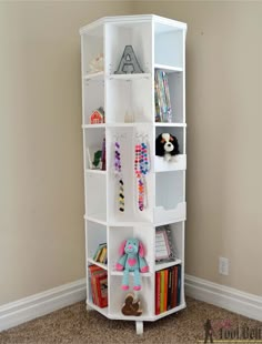 a white book shelf with stuffed animals and toys on it's sides in a corner