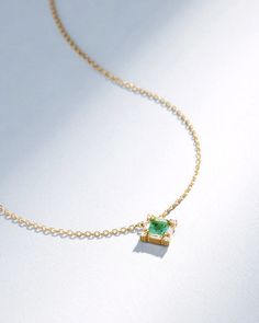 Elevate your style with this exquisite 18K gold Princess Midi pendant. It features a stunning 4x4mm princess-cut emerald center stone, surrounded baguette and round white diamonds. The diamonds are arranged in a complimenting pattern, adding a touch of luxury and sophistication to your style. Details 18k yellow gold 4x Timeless Green Jewelry With Baguette Diamonds, Elegant Emerald Cut Diamond Emerald Necklace, Fine Jewelry Emerald With Baguette Diamonds, Emerald Cut Baguette Diamonds May Birthstone Jewelry, Fine Jewelry With Baguette Diamonds And Emerald, Emerald Cut Baguette Diamond Jewelry For May Birthstone, Elegant Emerald Cut Diamond Necklace, Elegant May Birthstone Diamond Necklace, Fine Jewelry Emerald Necklace With Square Yellow Gold Pendant