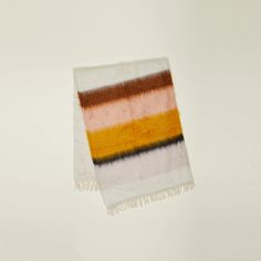 a multicolored towel hanging on a wall