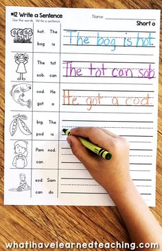 a hand holding a pen over a paper with writing on it and the words, the boy