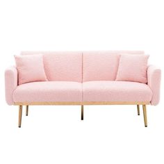 a pink couch sitting on top of a wooden frame