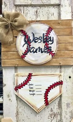 a baseball themed door hanger with the words westy banks on it and a bow