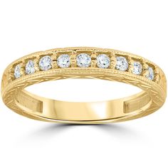 a yellow gold wedding band with round cut diamonds