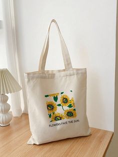 Elevate your style with our Stylish and Versatile Women's Tote Bag. Featuring a vibrant sunflower design and a motivational message, this bag is the perfect accessory for any occasion. Embrace fashion and function with this must-have tote. Color : Beige Bag Size : Small Pattern Type : Plants Type : Shoulder Tote Bag Material : Polyester Composition : 100% Polyester Bag Height Bag Length Bag Width Handle Height 15.4 13.4 0.4 10.2 Motivational Message, Beige Bag, Motivational Messages, Sunflower Design, Shoulder Tote Bag, Shoulder Tote, Womens Tote Bags, Elevate Your Style, Sunflower