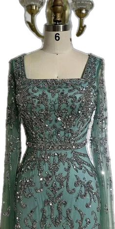 Silver Fitted Dress For Reception, Festive Turquoise Dress For Party, Festive Turquoise Party Dress, Elegant Turquoise Gown For Wedding, Elegant Floor-length Turquoise Gown, Floor-length Turquoise Gown For Party, Turquoise Floor-length Gown For Party, Elegant Turquoise Floor-length Gown, Elegant Turquoise Evening Gown