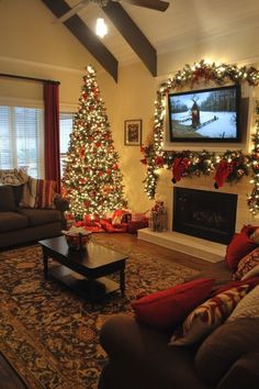 a living room decorated for christmas with lights on the trees