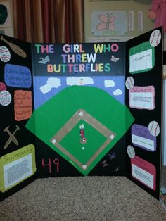 the girl who threw butterflies is displayed in front of a bulletin board with baseballs on it