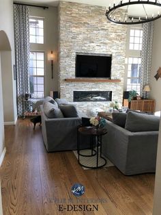 a living room filled with furniture and a flat screen tv mounted on the wall above a fireplace