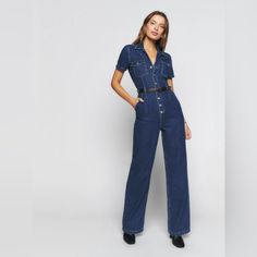 Rock A Retro Take On The Utility Trend In This Wide-Leg Denim Jumpsuit Detailed With Silvery Buttons, A Notched Collar And Plenty Of Pockets. Condition: Very Good, No Marks, Stains, Or Damage. All Buttons Are Securely Attached. Sizing: Size 8; Runs True To Size, It Does Have Some Stretch And Is A Softer Denim. Brand Info: 58" Length; 30" Inseam; 18" Leg Opening (Size 8) Notched Collar Short Sleeves 100% Cotton Machine Wash, Tumble Dry Made In Turkey Item # 7406475 Medium Wash High Waist Denim Jumpsuit For Work, Denim Blue High Waist Jumpsuits For Work, High Rise Denim Blue Jumpsuit For Work, High Waist Denim Blue Jumpsuits For Work, Dark Wash Straight Leg Jumpsuits For Workwear, Fitted Denim Jumpsuit With Wide Leg For Workwear, Fitted Wide Leg Overalls For Workwear, Denim Jumpsuits And Rompers For Work, Dark Wash High Rise Jumpsuits For Work