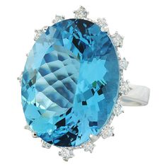 Stamped: 14K Total Ring Weight: 7.2 Grams Topaz Weight 33.57 Carat (22.75x18.00 Millimeters)Diamond Weight: 0.55 carat (F-G Color, VS2-SI1 Clarity )Face Measures: 27.90x21.50 Millimeter SKU: [600818] Luxury Topaz Ring With Brilliant Cut For Formal Occasions, Formal Aquamarine Diamond Ring With Gemstone, Oval Gia Certified Topaz Ring For Formal Occasions, Formal Oval Topaz Ring Gia Certified, Gia Certified Oval Topaz Ring For Formal Occasions, Formal Aquamarine Diamond Ring, Dazzling Oval Topaz Ring For Formal Occasions, Luxury Gia Certified Topaz Ring For Formal Occasions, Oval Blue Topaz Diamond Ring For Formal Occasions