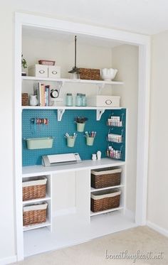 a room with some shelves and baskets on the wall next to each other in it