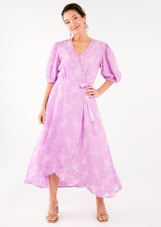 Accented with subtly puffed sleeves that gather at the cuff, our Diane Wrap Dress in this floral burnout chiffon will take you from weddings to dinner parties all season. This ethereal wrap comes complete with a solid slip in a matching color -- throw the slip on first, then secure the inside and outside ties on the dress. With a slight high-low hemline and flattering cut, this dress takes a classic wrap dress to the next level Sizing: Classic fit. We recommend ordering your true size. Make: Wra Elegant Chiffon Wrap Dress For Spring, Fitted Wrap Dress For Spring Wedding Guest, Spring Chiffon Wrap Dress For Party, Spring Wedding Wrap Dress With Surplice Neckline, Pink Wrap Dress For Spring Formal Events, Elegant Lavender Puff Sleeve Dress, Lavender Sunflower, Dress Lavender, First Then