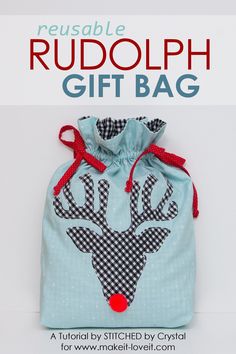 a blue bag with a deer on it and the words rudolph gift bag