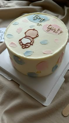 there is a cake on the table for someone's baby shower party or celebration